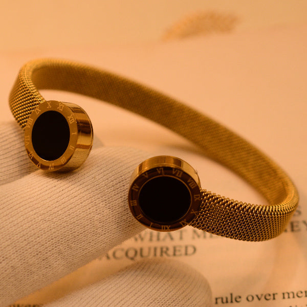 Elegant Gold Mesh Bangle with Black Onyx Accents